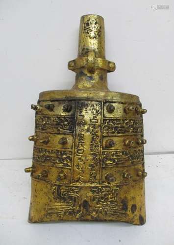 A Chinese Qing dynasty gilt metal temple bell, in the classic Chinese bronze age style with