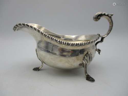 An Elizabeth II silver sauce boat by C.J Vander, London 1971, with gadrooned border and acanthus