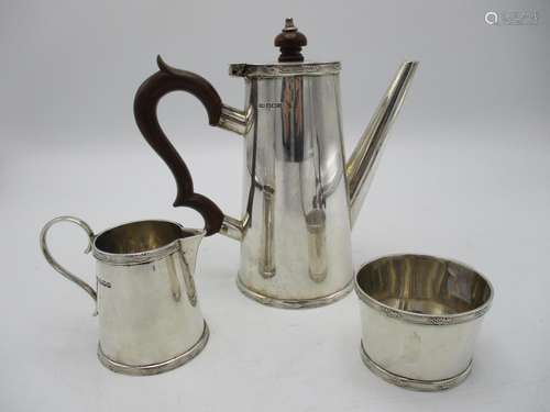 A George V silver three piece coffee set by Mappin & Webb, Sheffield 1927 of tapered cylindrical