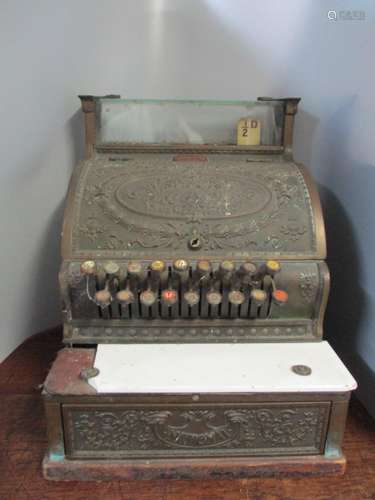 A National Cash Register Co brass till with wreath and scrolled foliage ornament, three glazed glass