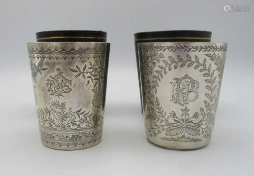 Two late Victorian silver beakers by Edwin Charles Purdie, London 1883 and 1887, both etched with