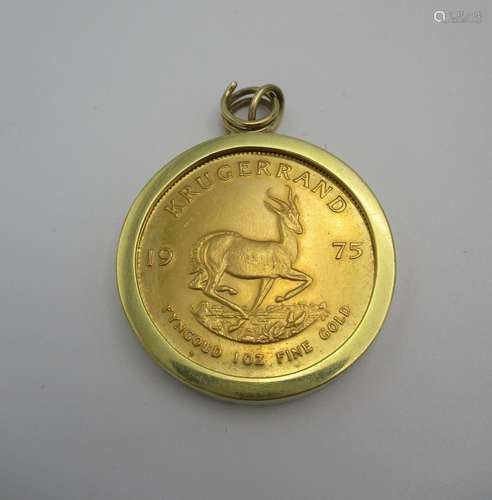 A gold Kruggerand, 1 oz, 1975, within a gold metal mount, the mount 15 g