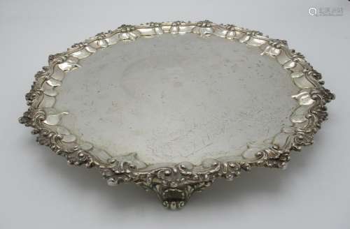 A Victorian silver salver by the Goldsmiths Alliance Ltd, London 1867, of circular shape with