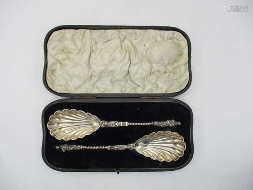 A cased pair of Victorian silver serving spoons by William Hutton & Sons, London 1894, with shell