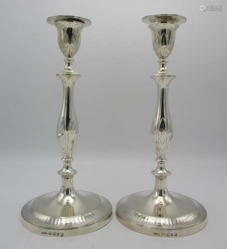 A pair of William IV silver candlesticks by John Green & Co, Sheffield 1834, in the Georgian taste