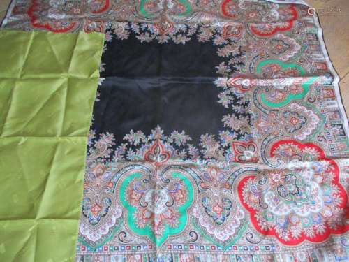 A 20th Century Chanel cream scarf with black hand sewn border and a single floral image in black,