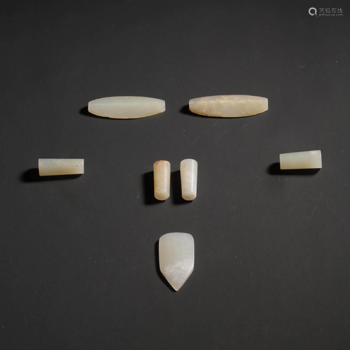 A Set of Seven White Jade Organ Plugs