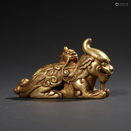 A Gilt-bronze Auspicious Beast Paperweight