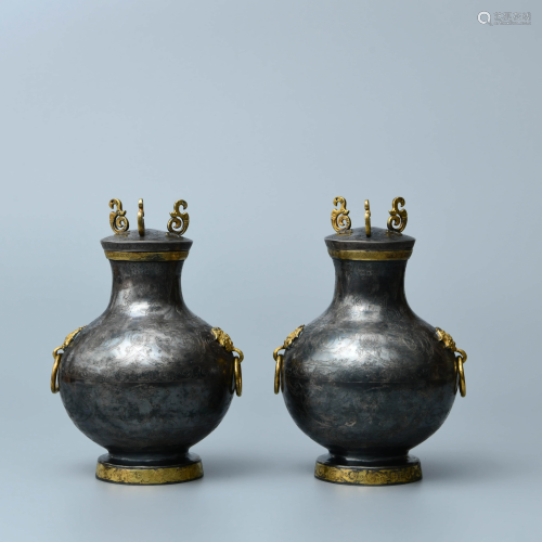 A pair of gilt-bronze drinking vessels
