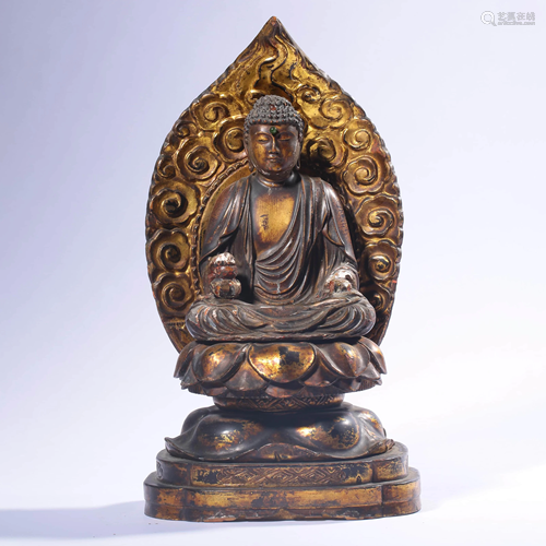 A Gilt Wood Carved Sitting Sakyamuni Statue