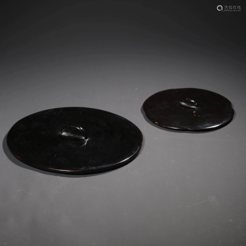 A Set of Two Black Lacquered Lids