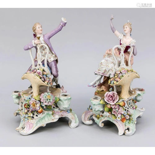 A pair of figurine candlestick