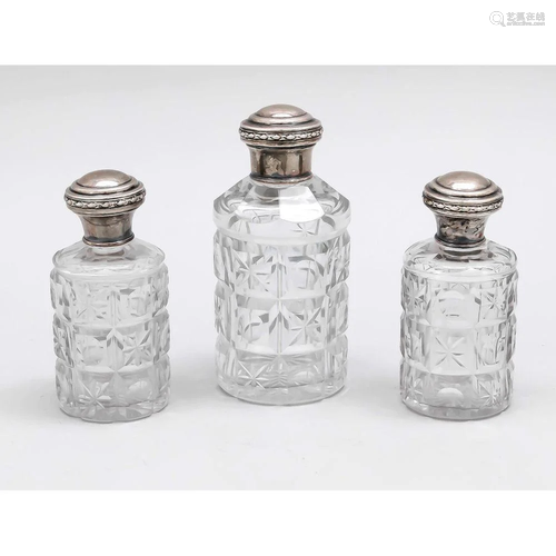 Three bottles with silver lids