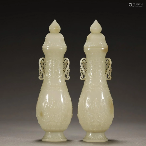 A PAIR OF ANCIENT CHINESE,WHITE JADE VASES