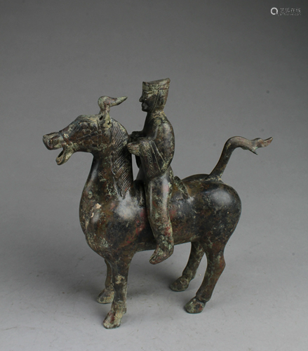 A Bronze Man Riding A Horse Statue