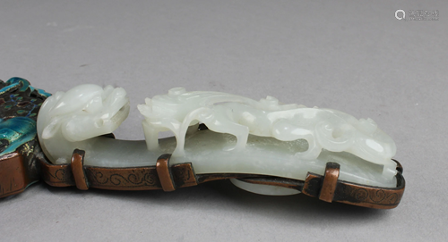 An Enamel Hand-held Mirror with A Carved Hetian Jade