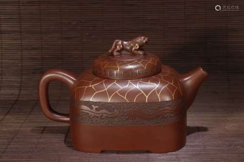 A Chinese Tea Pot With Beast Pattern