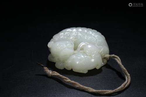 A Chinese Hetian Jade Pendant With Beast Carving