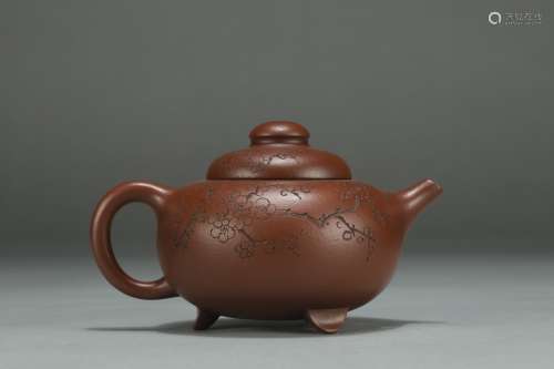 A Chinese Zisha Tea Pot With Flower Pattern