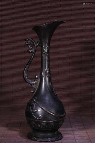 A Chinese Bronze Vessel With Dragon Carving