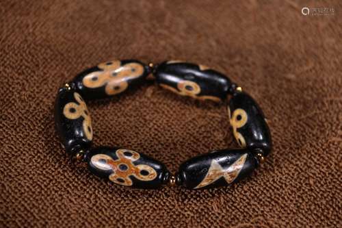 A Chinese Dzi Bracelet