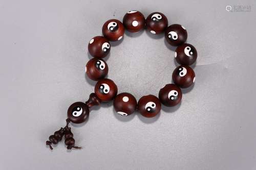 A Chinese Red Wood Bracelet