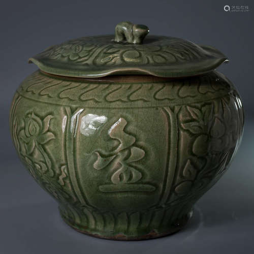 A Chinese Celadon Floral Carved Jar with Lotus Leaf Shaped Cover