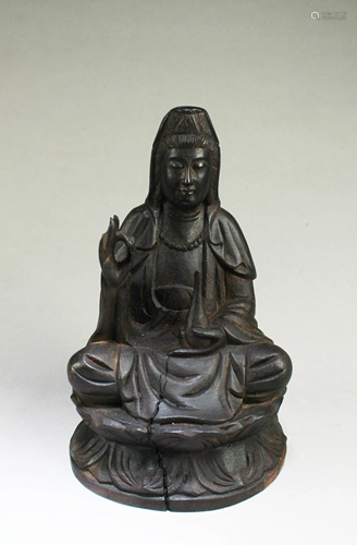 A Carved Wooden Seated Guanyin Statue