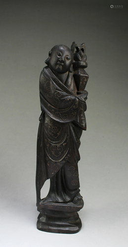 A Carved Wooden Figurine