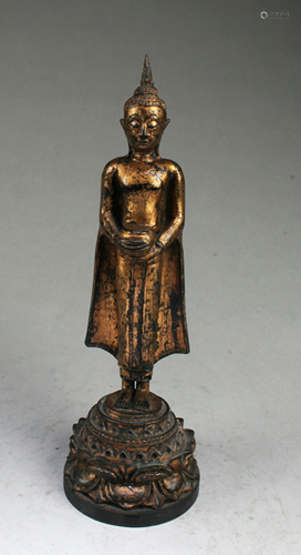 A Carved Wooden Standing Buddha Statue