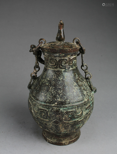 A Bronze Jar With Lid