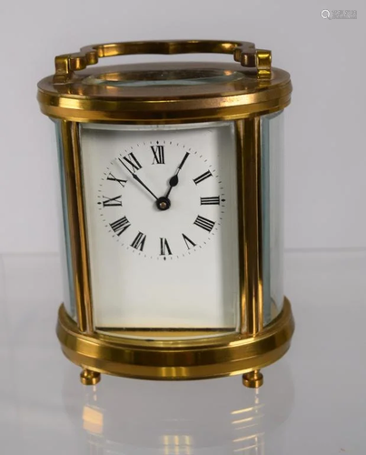 BRASS OVAL SHAPE BRASS & GLASS CARRIAGE CLOCK