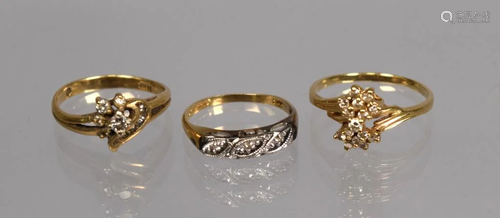 THREE 14K GOLD DIAMOND RINGS.