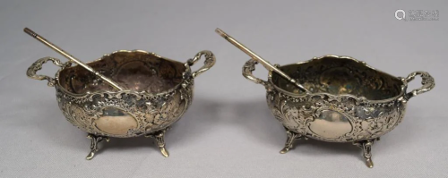 TWO ORNATE SILVER SALTS WITH SPOONS