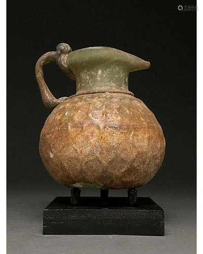 LARGE ROMAN NET-PATTERN GLASS FLASK WITH HANDLE