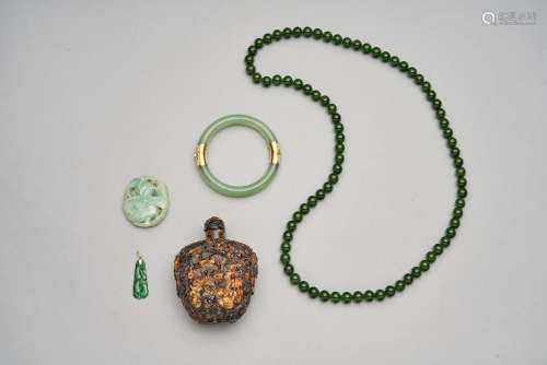 A group of four jadeite jewellery and an amber snuff bottle  Late Qing dynasty and later