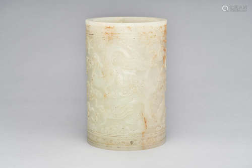 A pale-celadon jade 'dragon and cloud' brush pot  Qianlong four-character mark