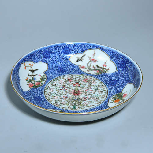 A POWDER ENAMEL PLATE PAINTED WITH FLOWERS
