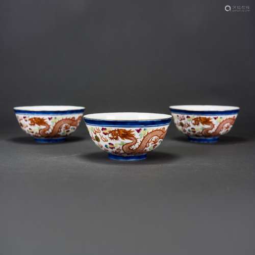 THREE IRON RED DECORATED BLUE & WHITE AND DOUCAI BOWLS, WITH GUANGXU MARK