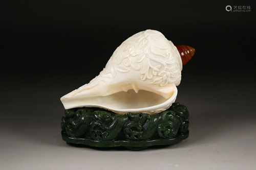 A WELL HAND CARVED CONCH SHELL DISPLAY ITEM