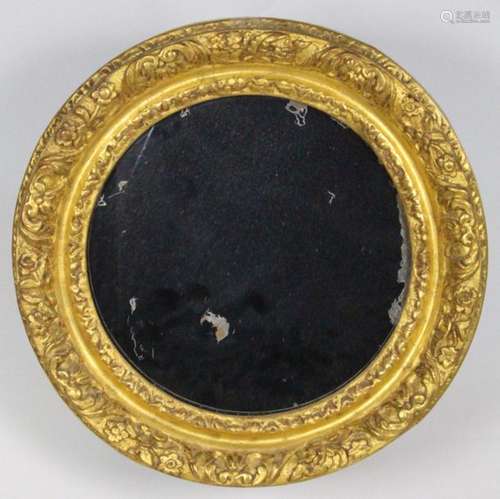 MIROIR de forme ronde en bois redoré et sculpté de…