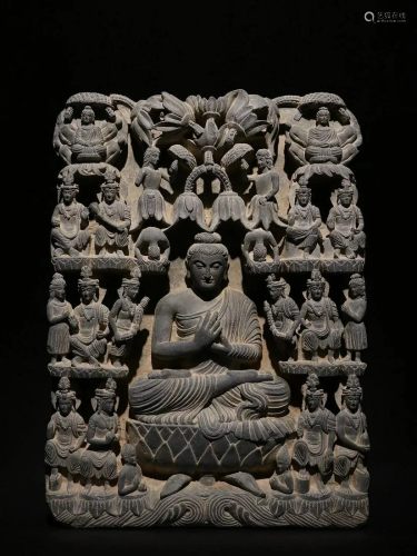 AN ASIAN BUDDHA STONE STATUE