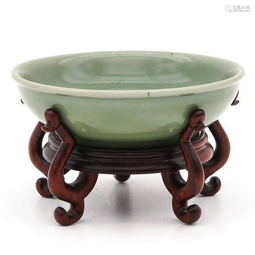 A Celadon Dish and Carved Wood Base