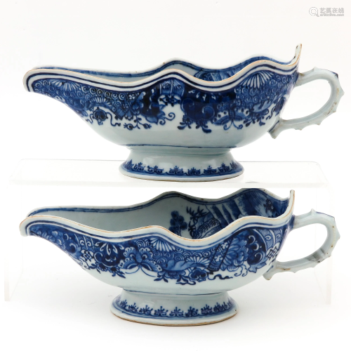 A Pair of Blue and White Gravy Boats