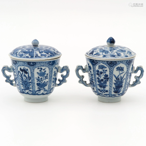 2 Blue and White Covered Cups