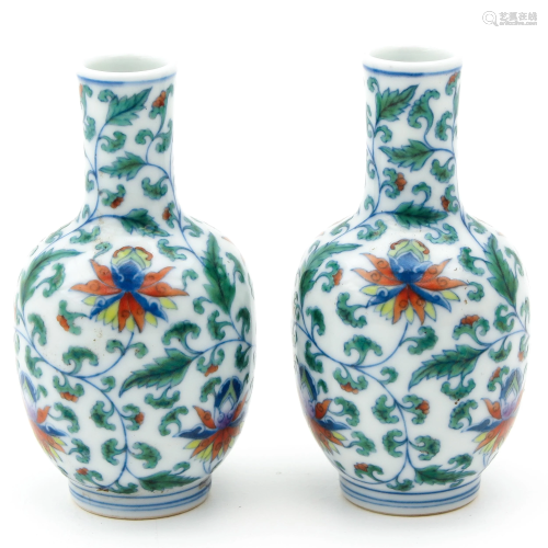 A Pair of Polychrome Small Vases