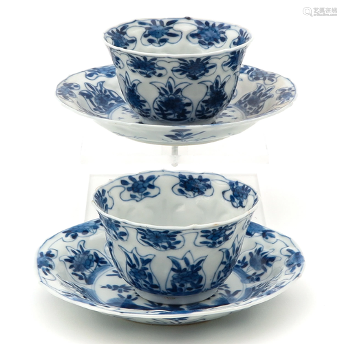 2 Blue and White Cups and Saucers