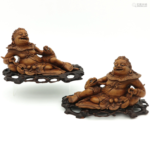 A Pair of Carved Wood Sculptures