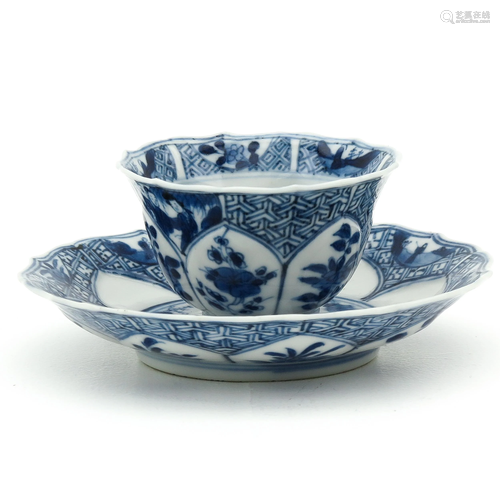 A Blue and White Cup and Saucer