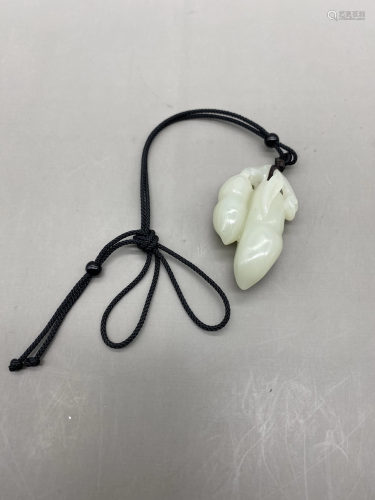 A carved piece of white jade Fulu flowers blooming in